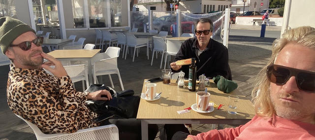 The band, looking tough